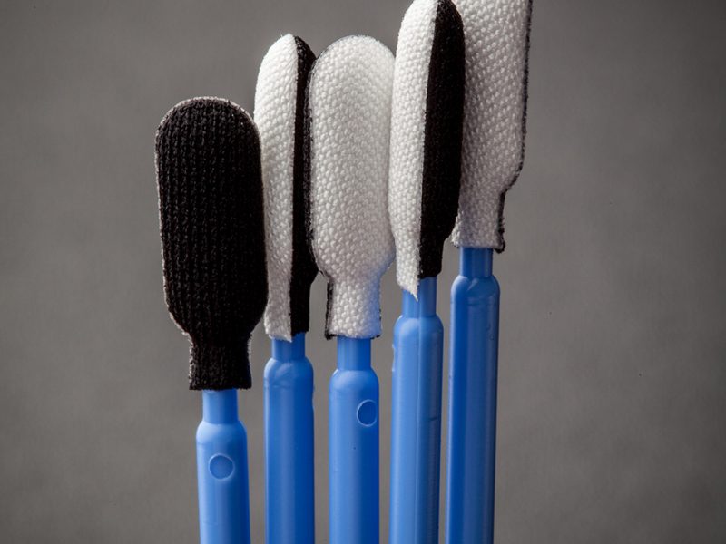 Five PolyCHECK Swabs in different possitions.